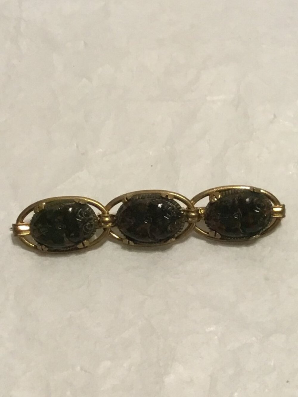Vintage gold tone brooch w/ three multicolored scarabs